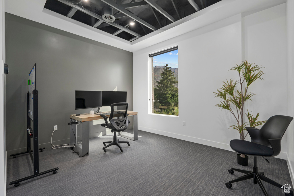 Office space featuring baseboards and carpet flooring