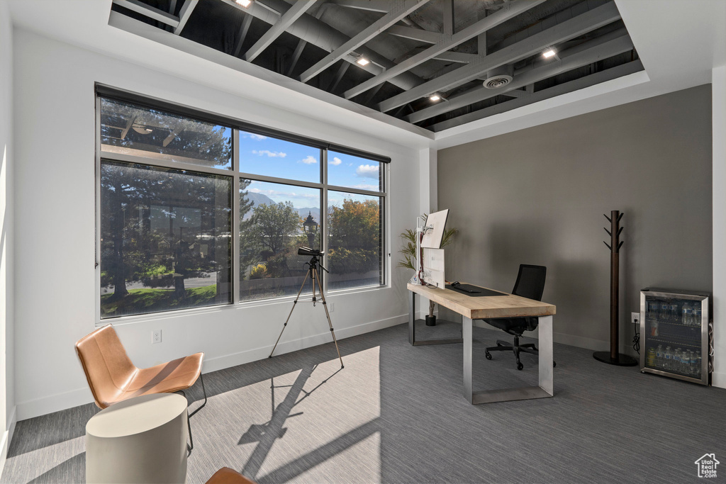 Office with baseboards and wine cooler