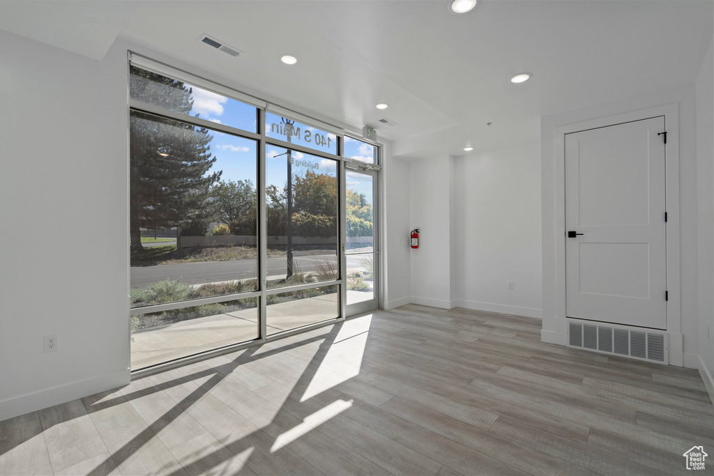 Unfurnished room with recessed lighting, baseboards, and visible vents