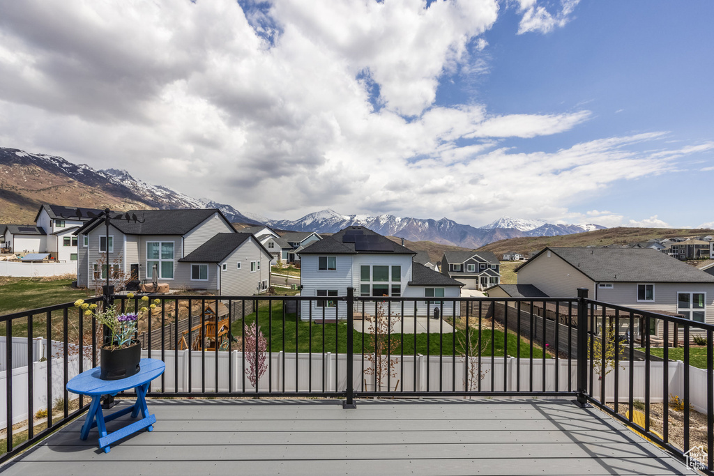 Wooden deck with a mountain view and a residential view