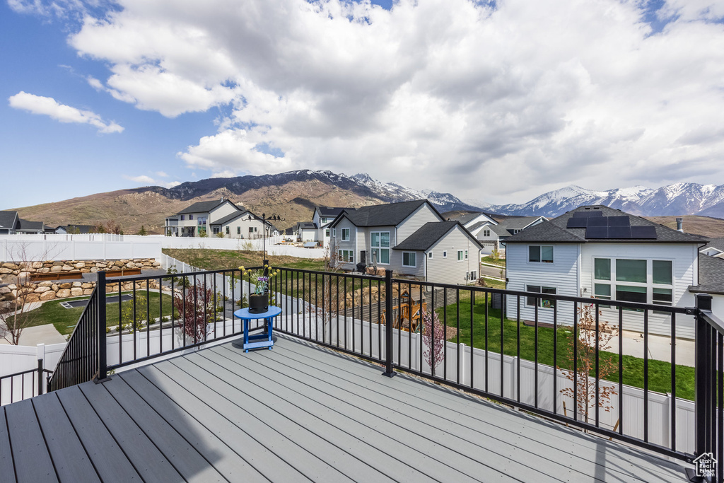 Deck featuring a mountain view and a residential view