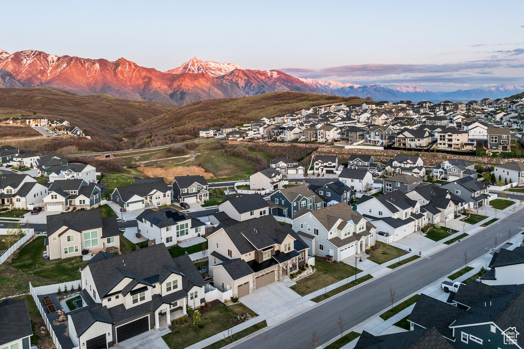 Aerial view at dusk with a residential view and a mountain view