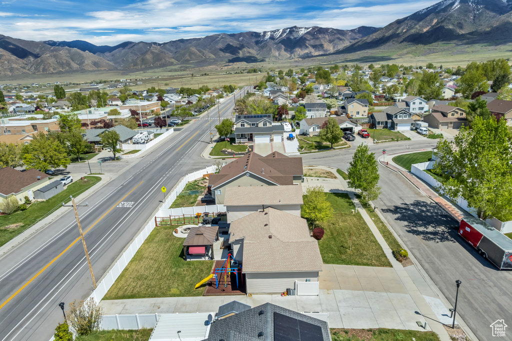 Birds eye view of property with a residential view and a mountain view