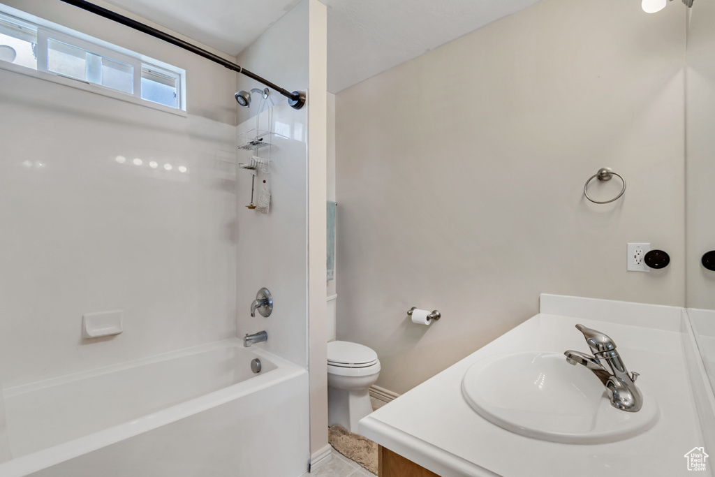 Full bath with vanity, toilet, and bathtub / shower combination
