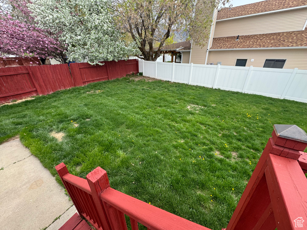 View of yard with a fenced backyard