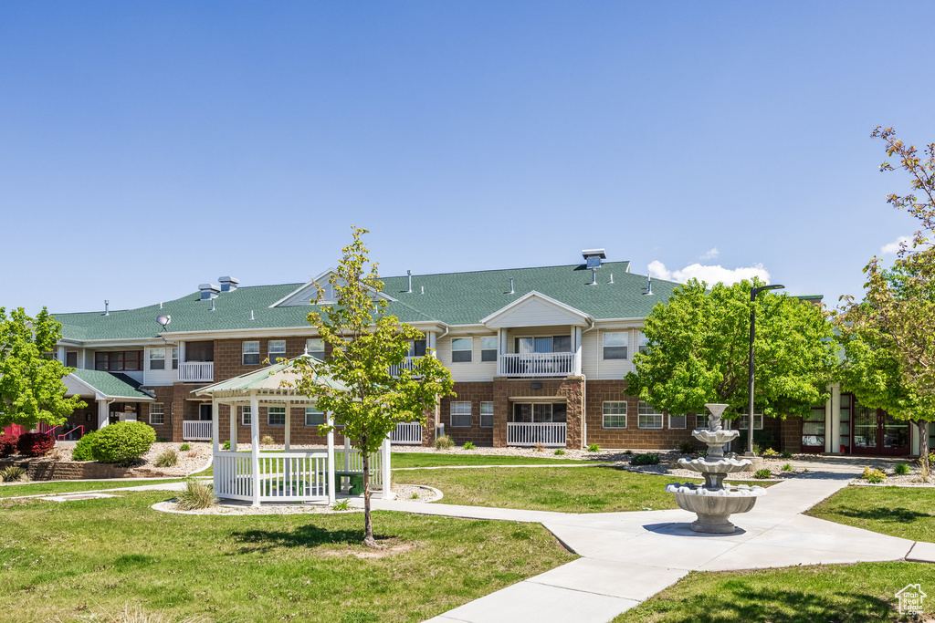 View of home's community featuring a yard