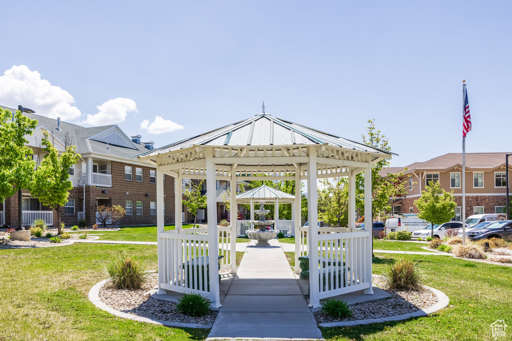 Surrounding community featuring a lawn and a gazebo