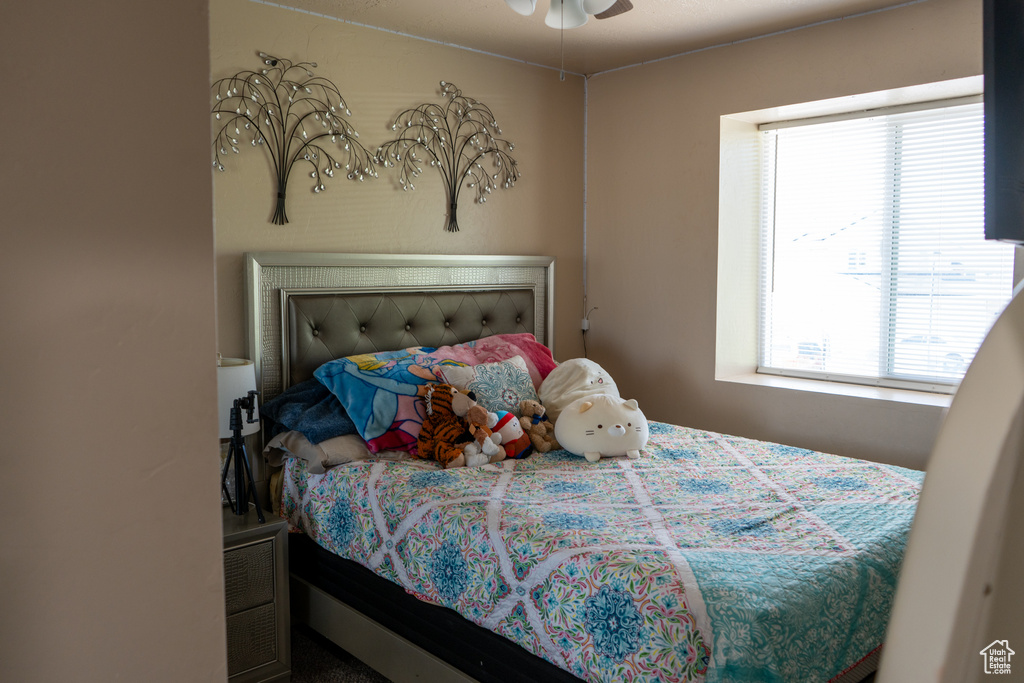 Bedroom with multiple windows