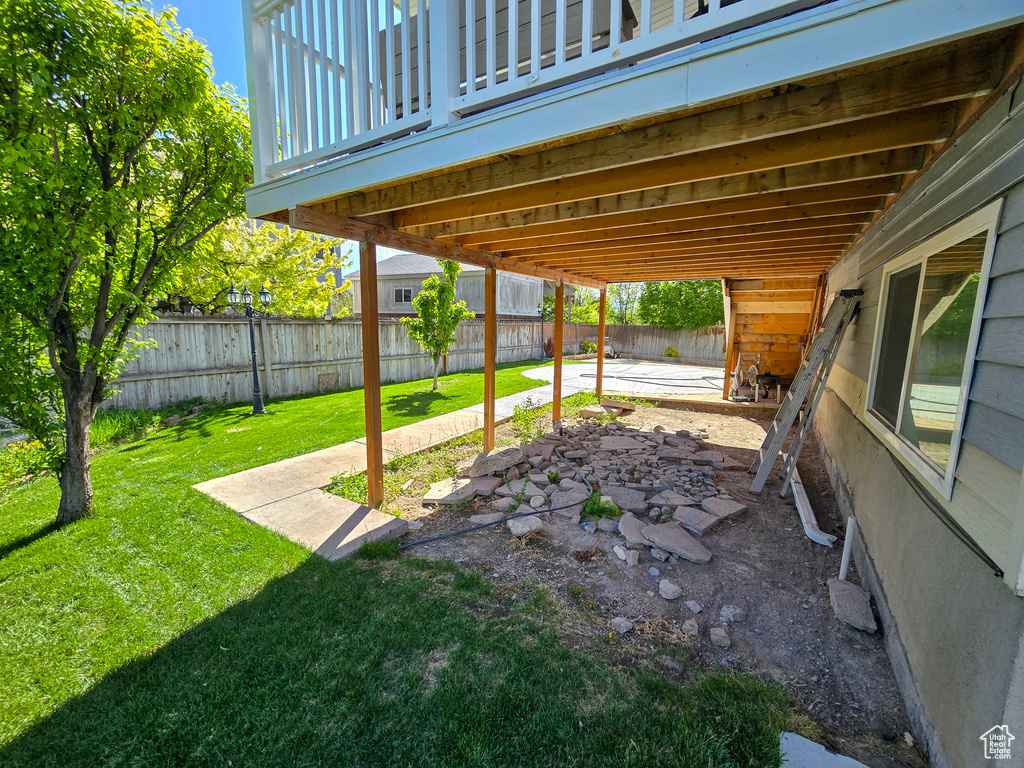 View of yard with a fenced backyard and a patio area