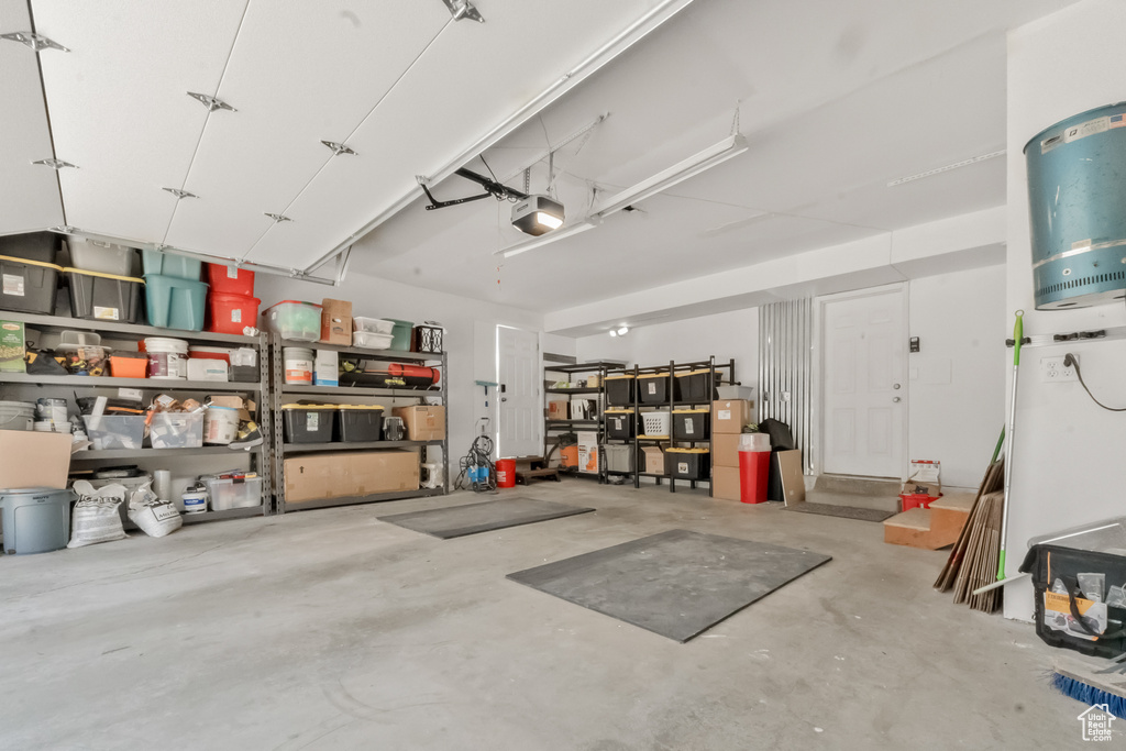 Garage featuring a garage door opener