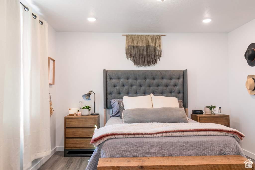 Bedroom featuring recessed lighting, baseboards, and wood finished floors