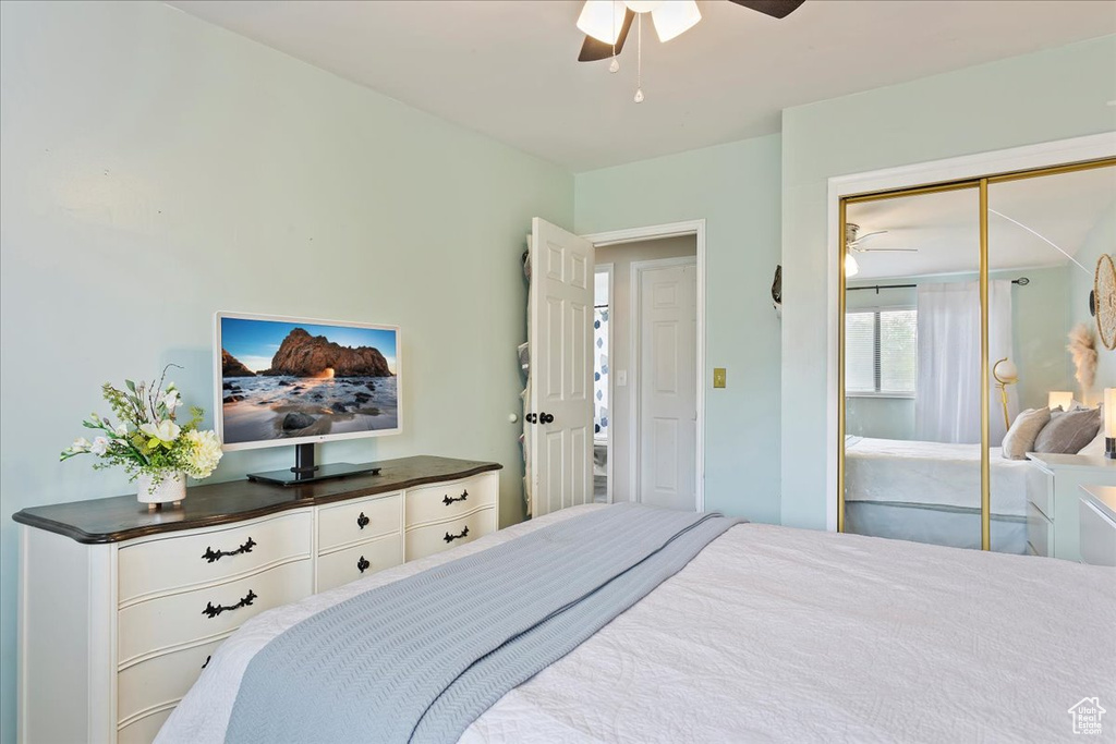 Bedroom with a ceiling fan and a closet