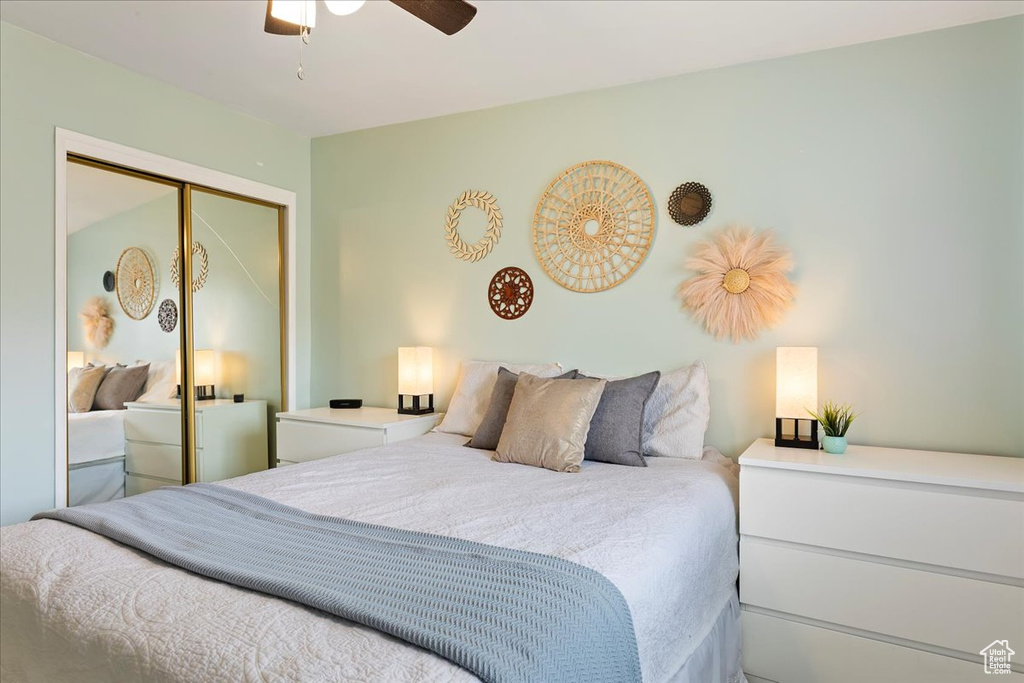 Bedroom featuring a ceiling fan and a closet