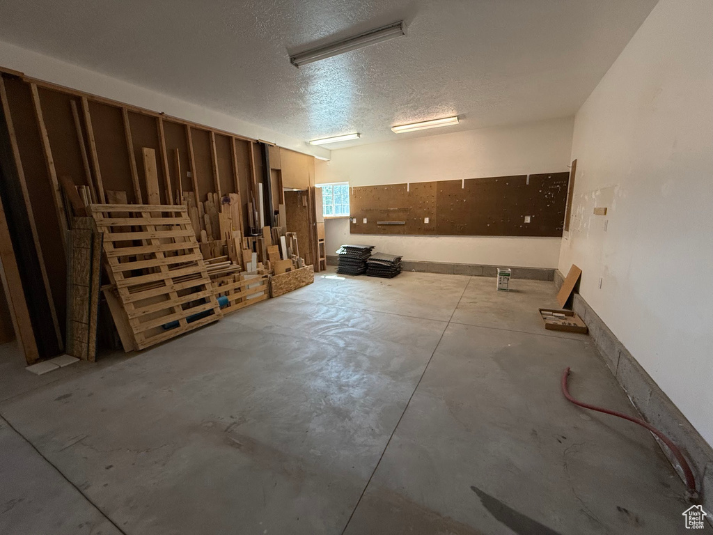 Below grade area featuring a textured ceiling