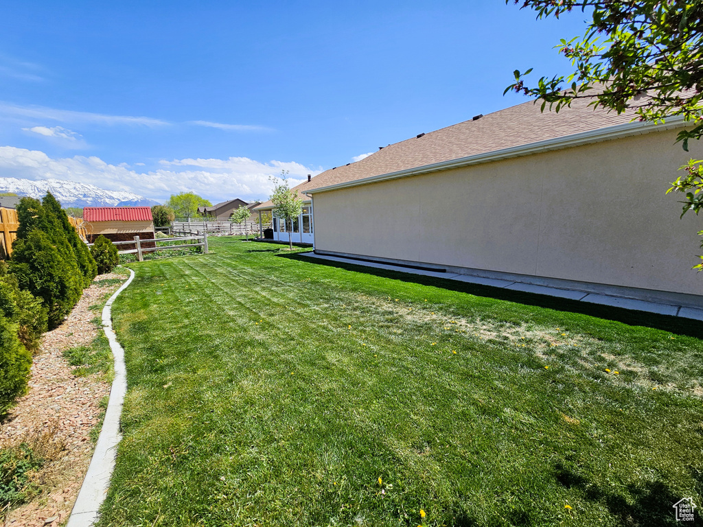 View of yard featuring fence