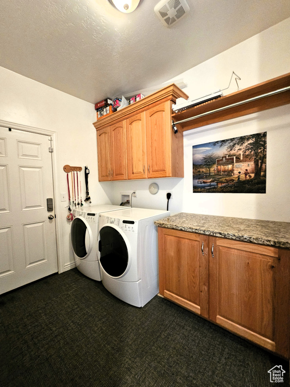 Washroom featuring visible vents, cabinet space, separate washer and dryer, and dark colored carpet