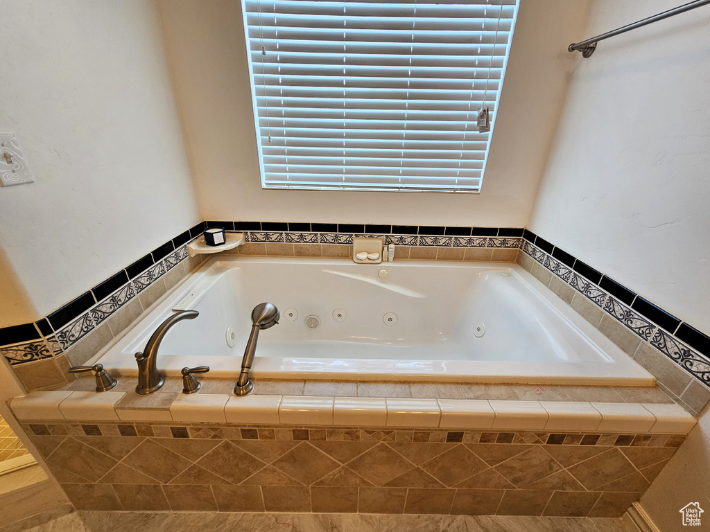 Full bath featuring a jetted tub