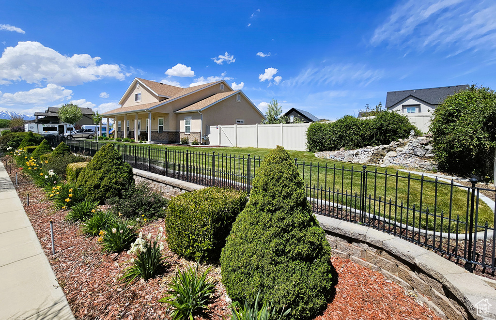 Exterior space with fence and stucco siding