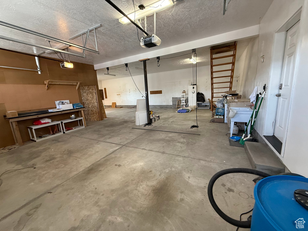 Garage featuring a garage door opener