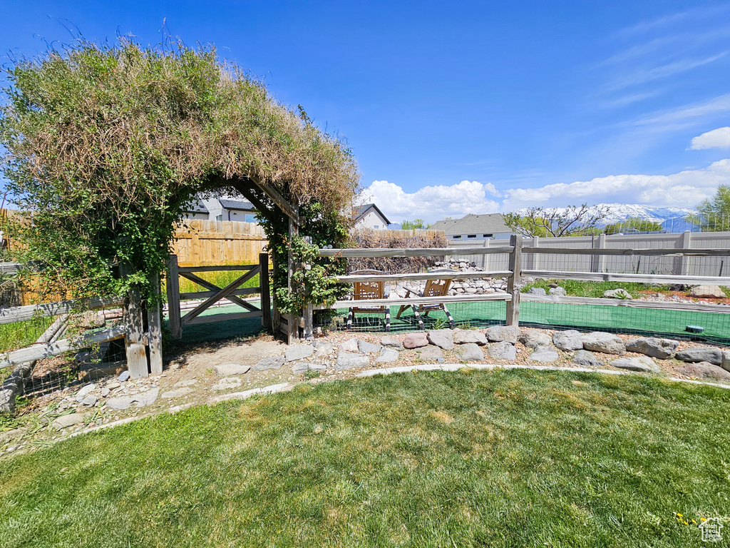 View of yard with fence
