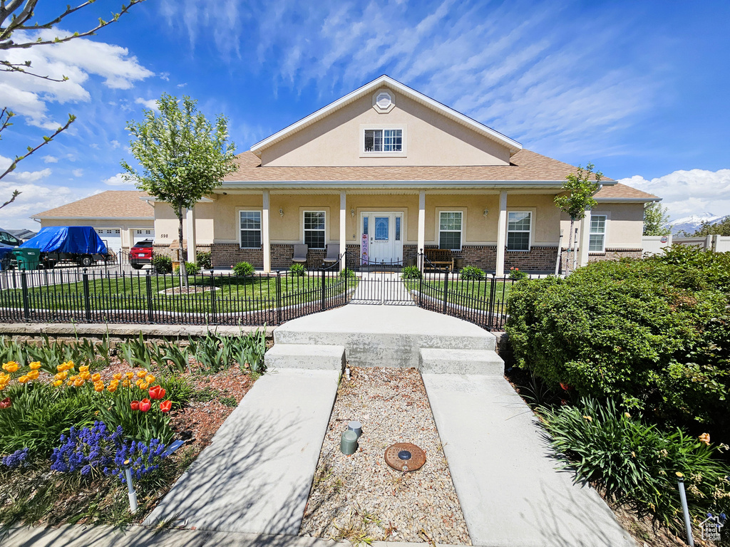 View of building exterior featuring a fenced front yard