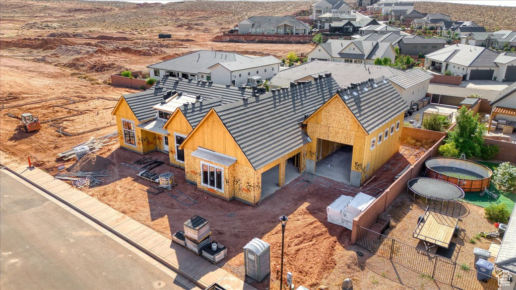 Aerial perspective of suburban area with a mountain backdrop