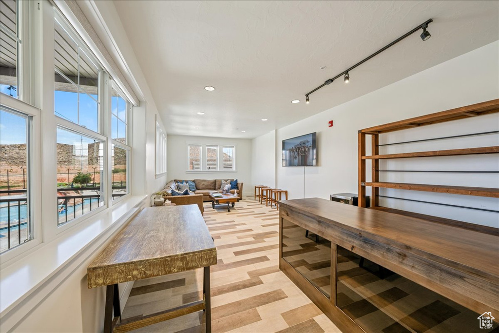 Interior space featuring track lighting and recessed lighting