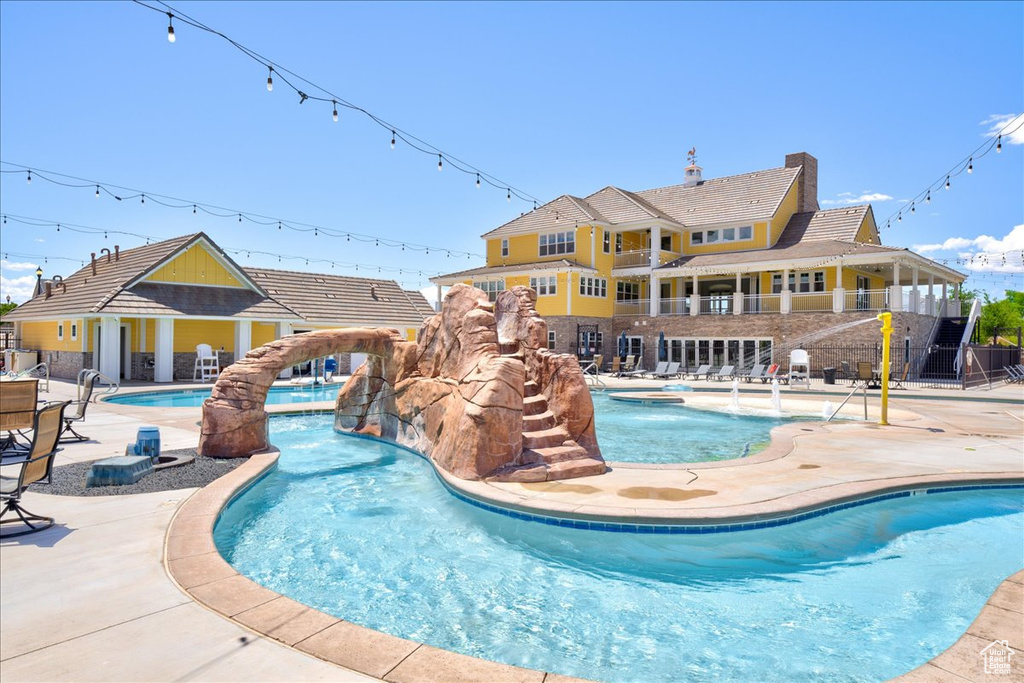 Community pool with a patio