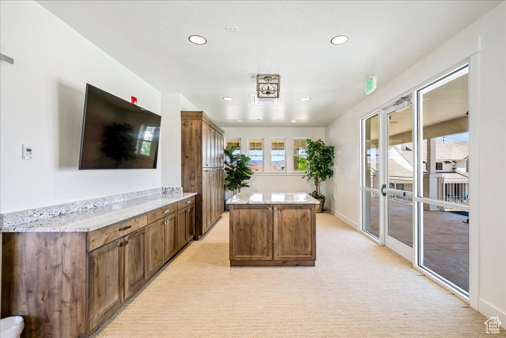 Office space with recessed lighting, light carpet, and baseboards