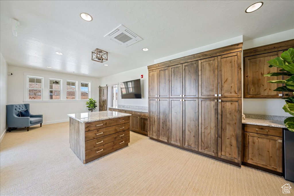 Interior space with visible vents and light carpet