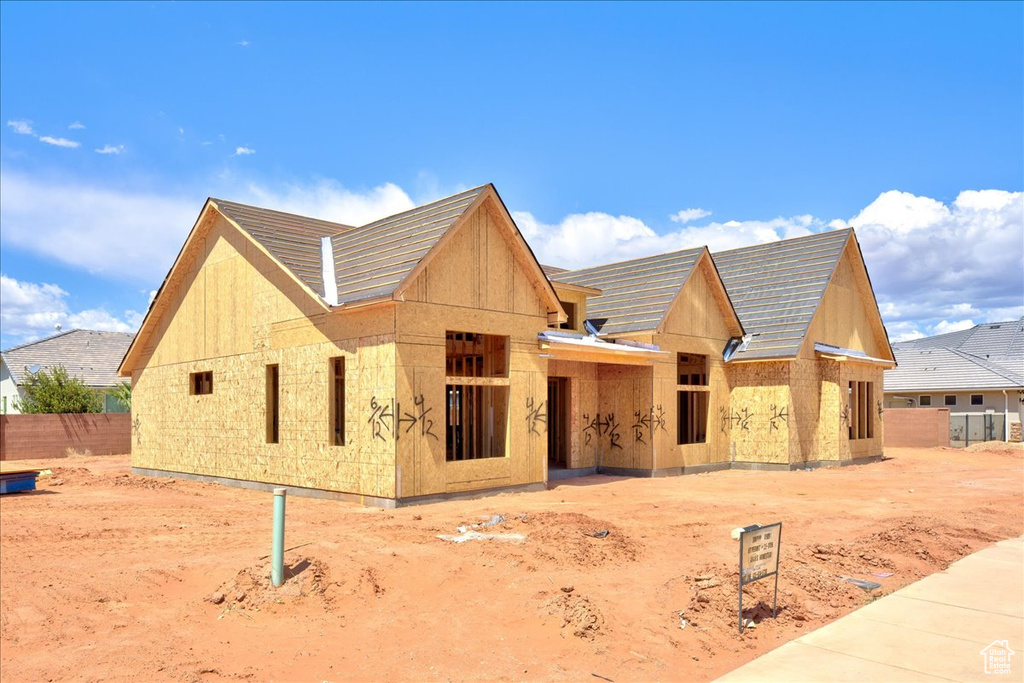 View of front of house featuring fence