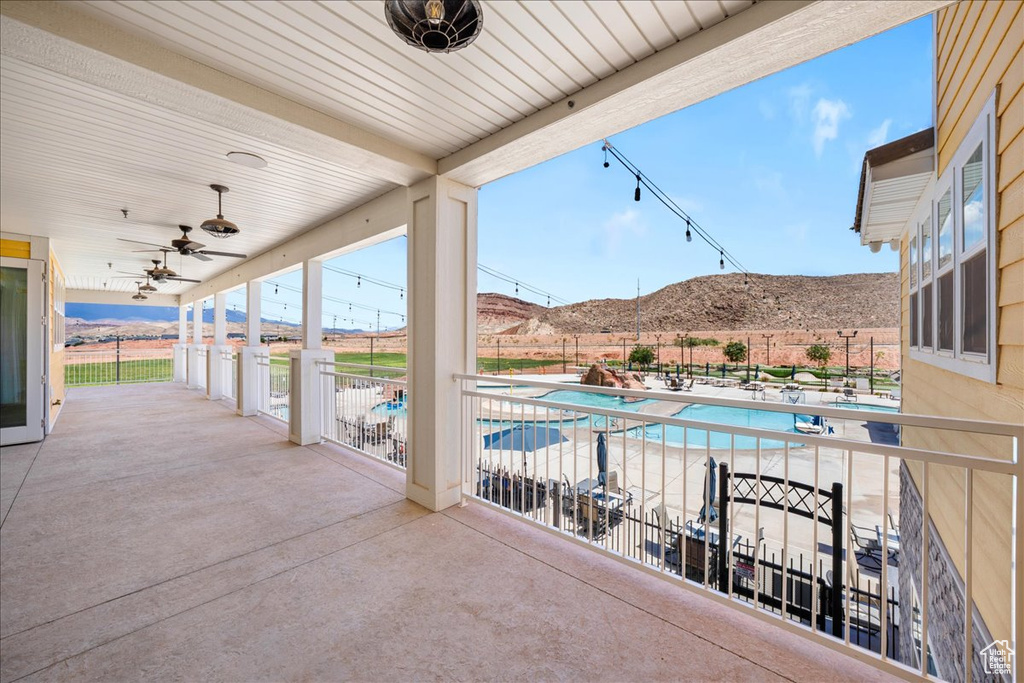 View of patio / terrace featuring a fenced in pool, a mountain view, and fence