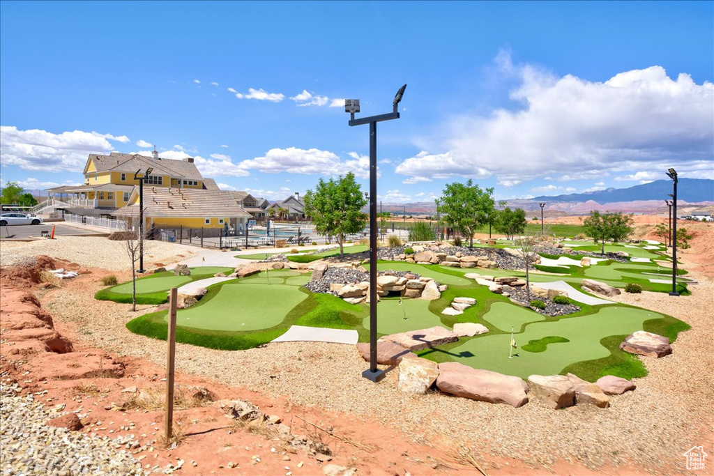 View of property's community featuring a mountain view and fence
