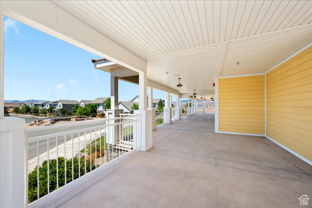 View of patio with a residential view and a balcony