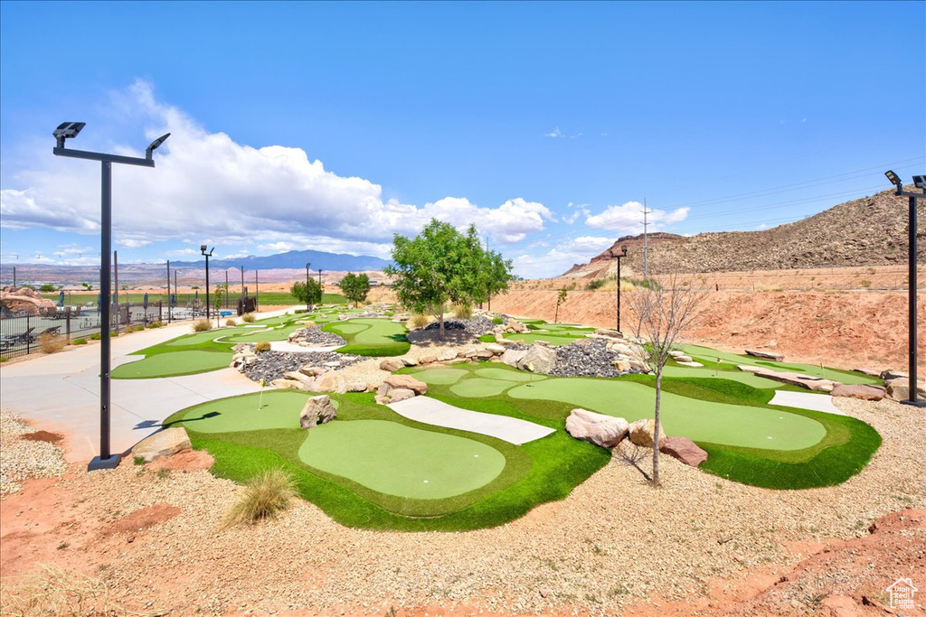 Surrounding community featuring fence and a mountain view