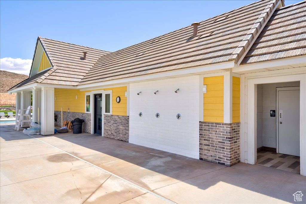 View of side of property featuring brick siding