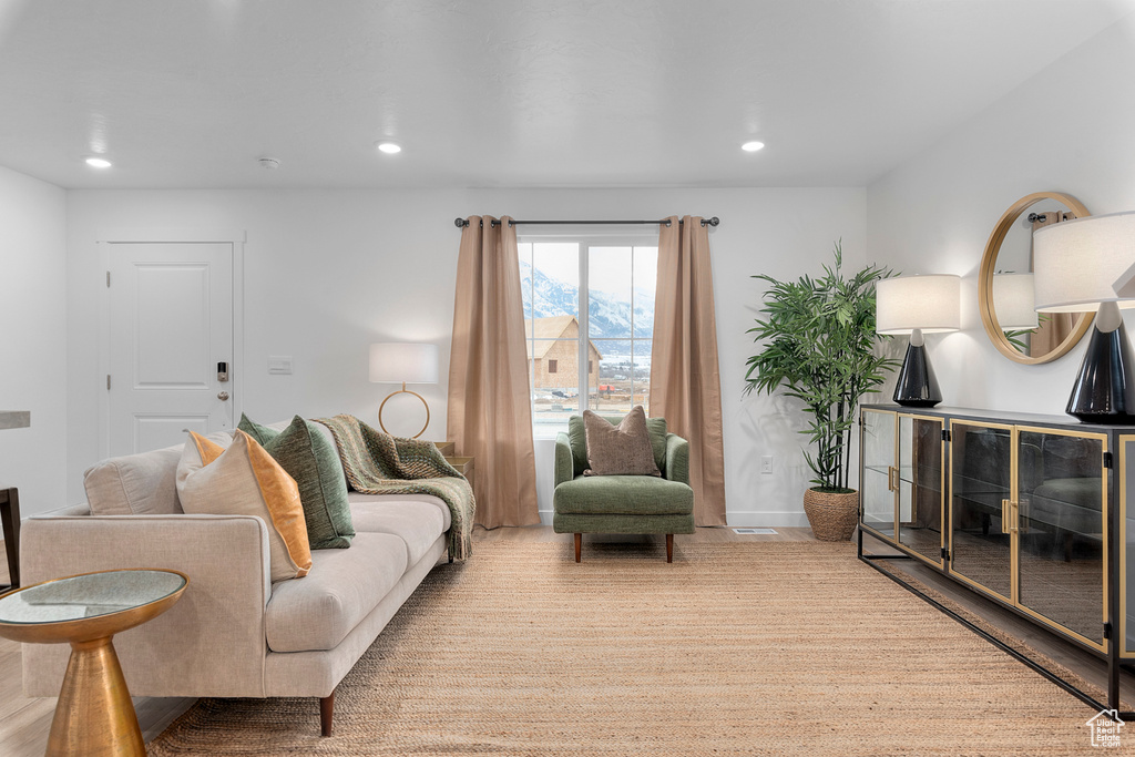 Living area with recessed lighting and baseboards