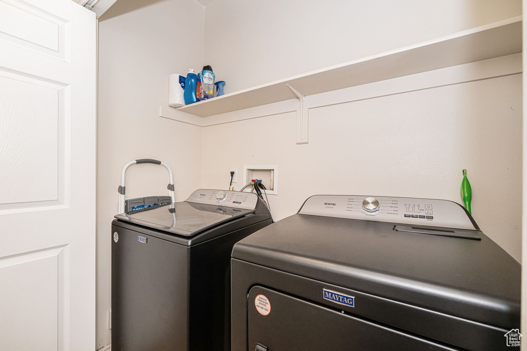 Laundry area featuring laundry area and washing machine and dryer