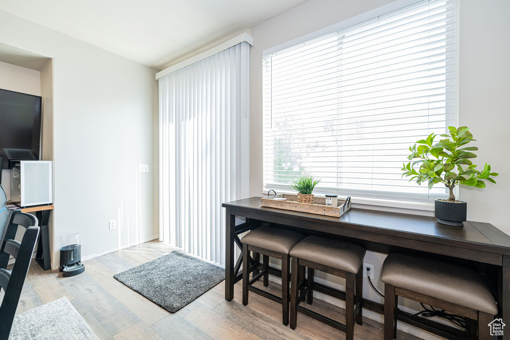 Dining space featuring baseboards and light wood finished floors