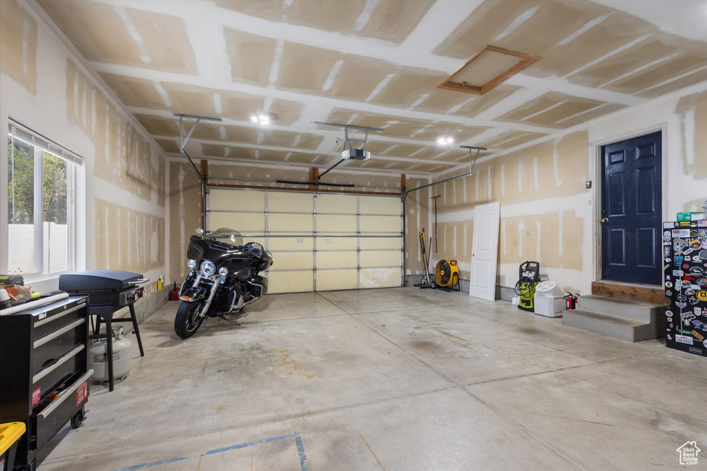 Garage featuring a garage door opener