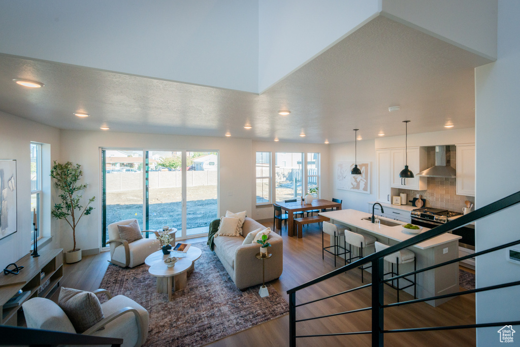 Living area featuring recessed lighting, baseboards, and wood finished floors