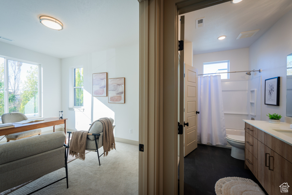 Bathroom with toilet, visible vents, recessed lighting, and vanity