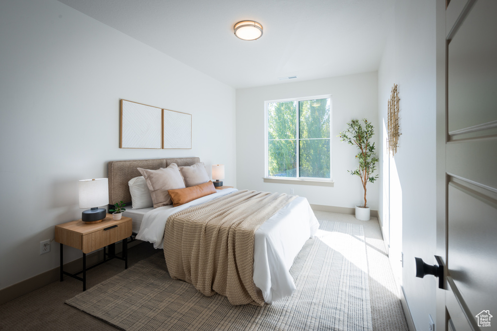 Bedroom featuring baseboards and carpet flooring
