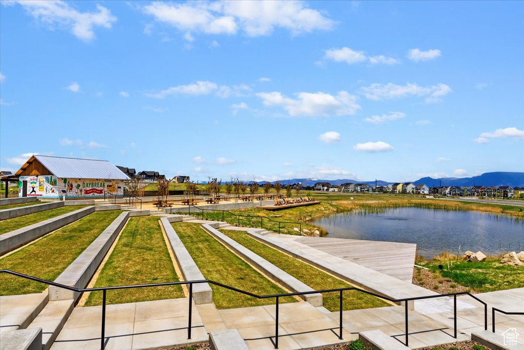 Exterior space featuring a water and mountain view