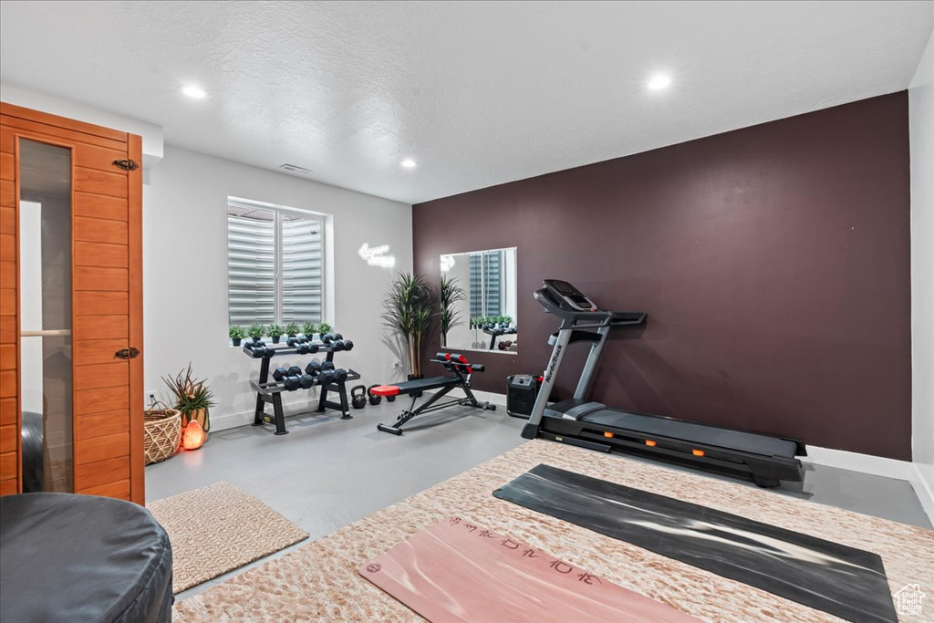 Exercise room featuring recessed lighting and baseboards