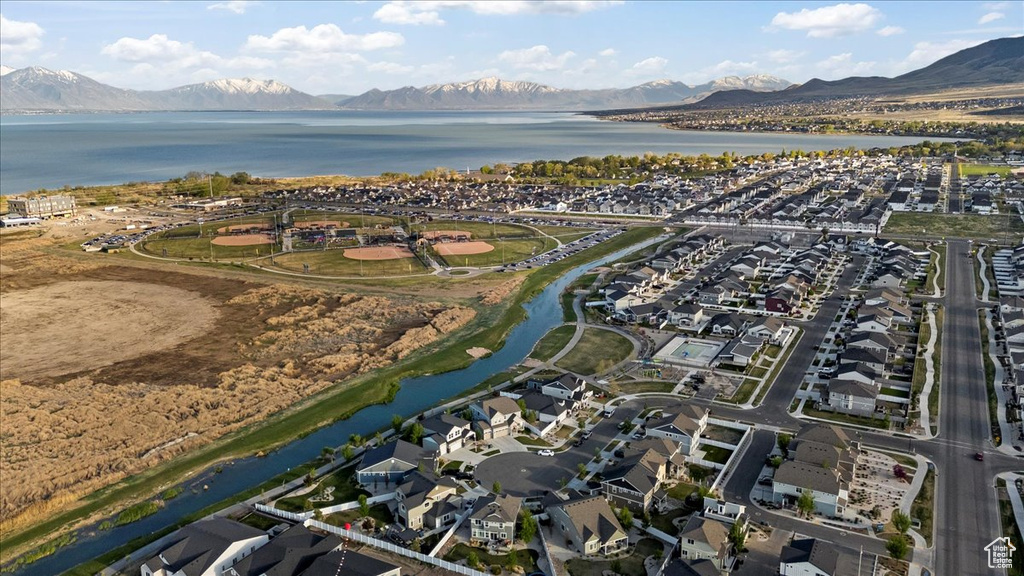 Birds eye view of property featuring a residential view and a water and mountain view