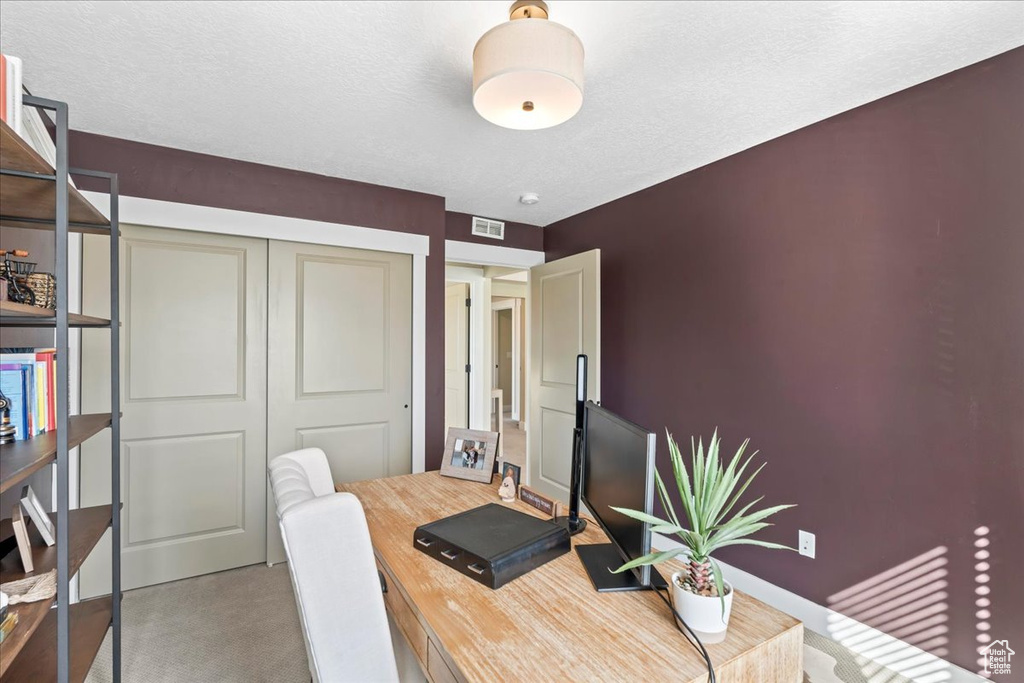 Home office featuring visible vents