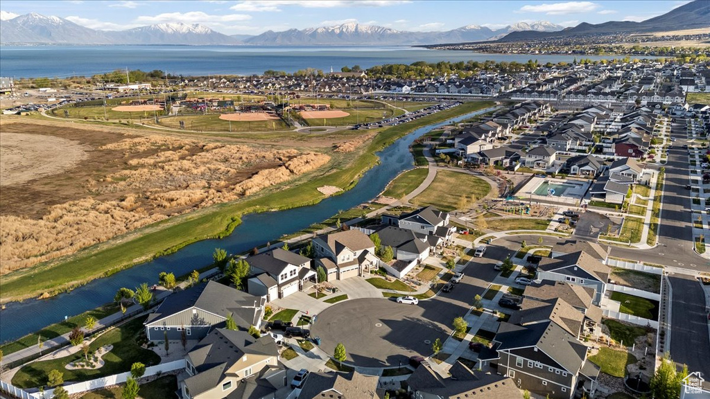 Birds eye view of property with a residential view and a water and mountain view