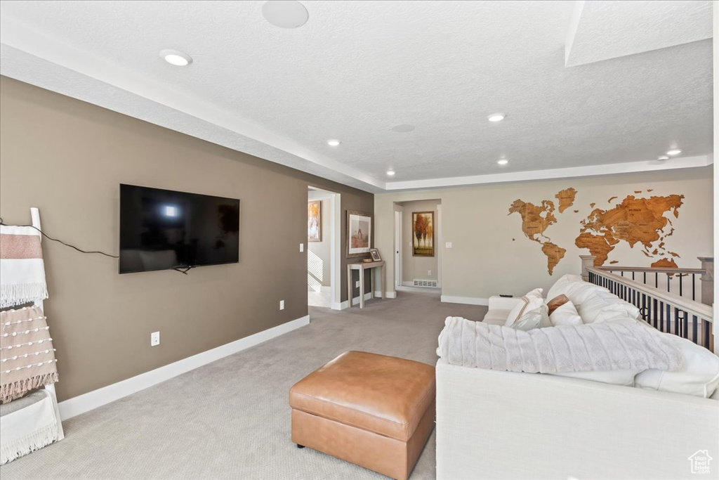 Living room featuring carpet flooring, recessed lighting, and baseboards