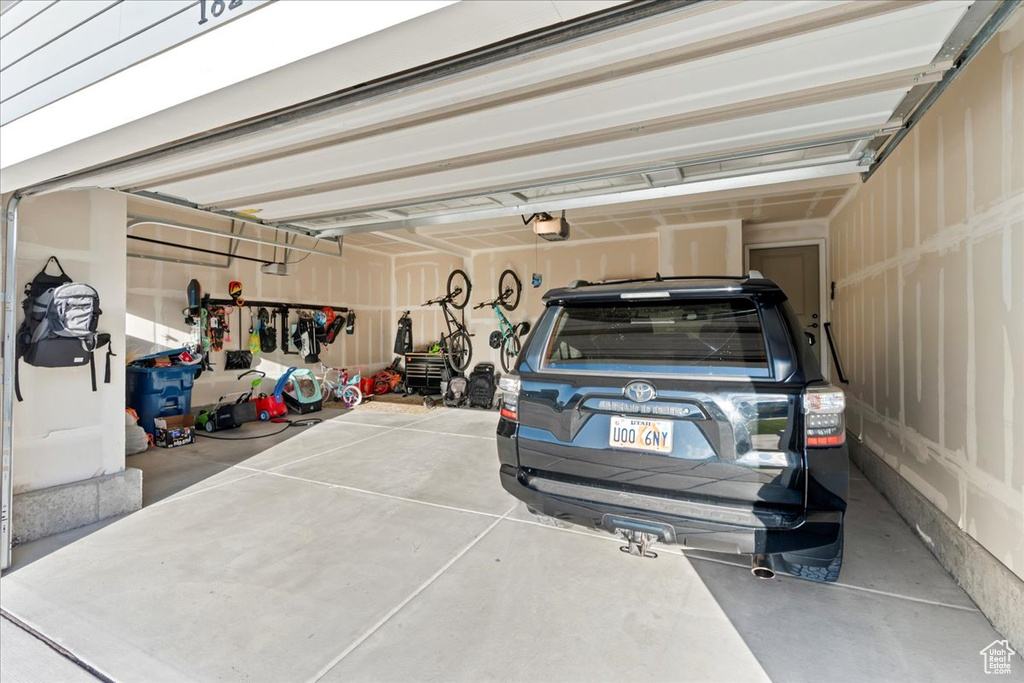 Garage featuring a garage door opener